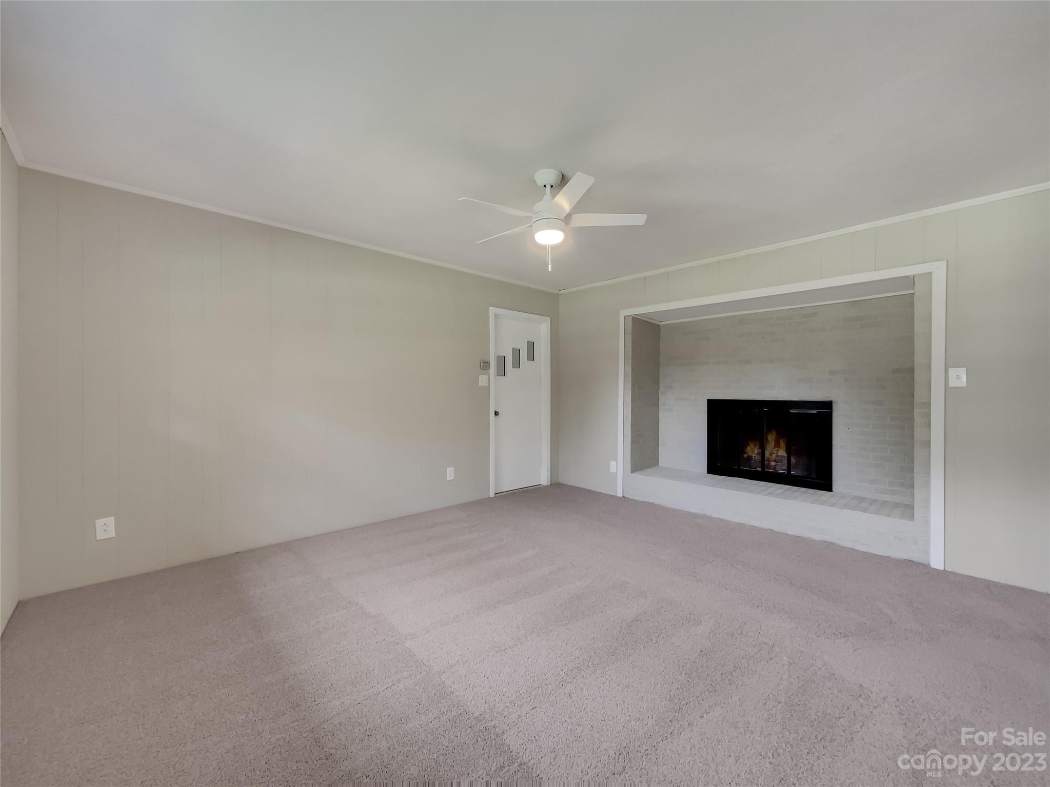 4719 Pleasant Grove Road Waxhaw, NC 28173 - Photo 11 of 24 a view of an empty room with a fireplace