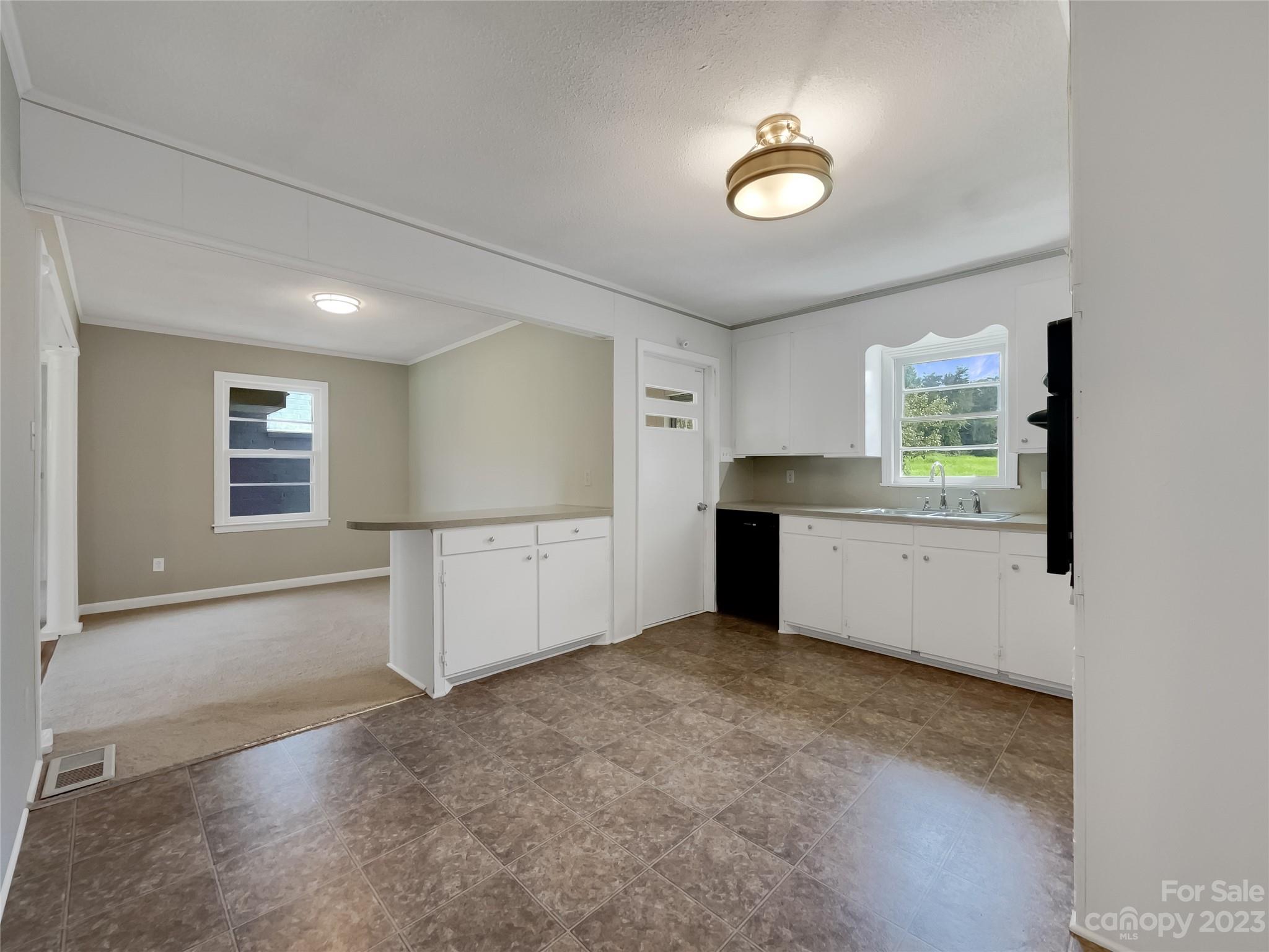 4719 Pleasant Grove Road Waxhaw, NC 28173 - Photo 13 of 24 an empty room with windows and pillars in it