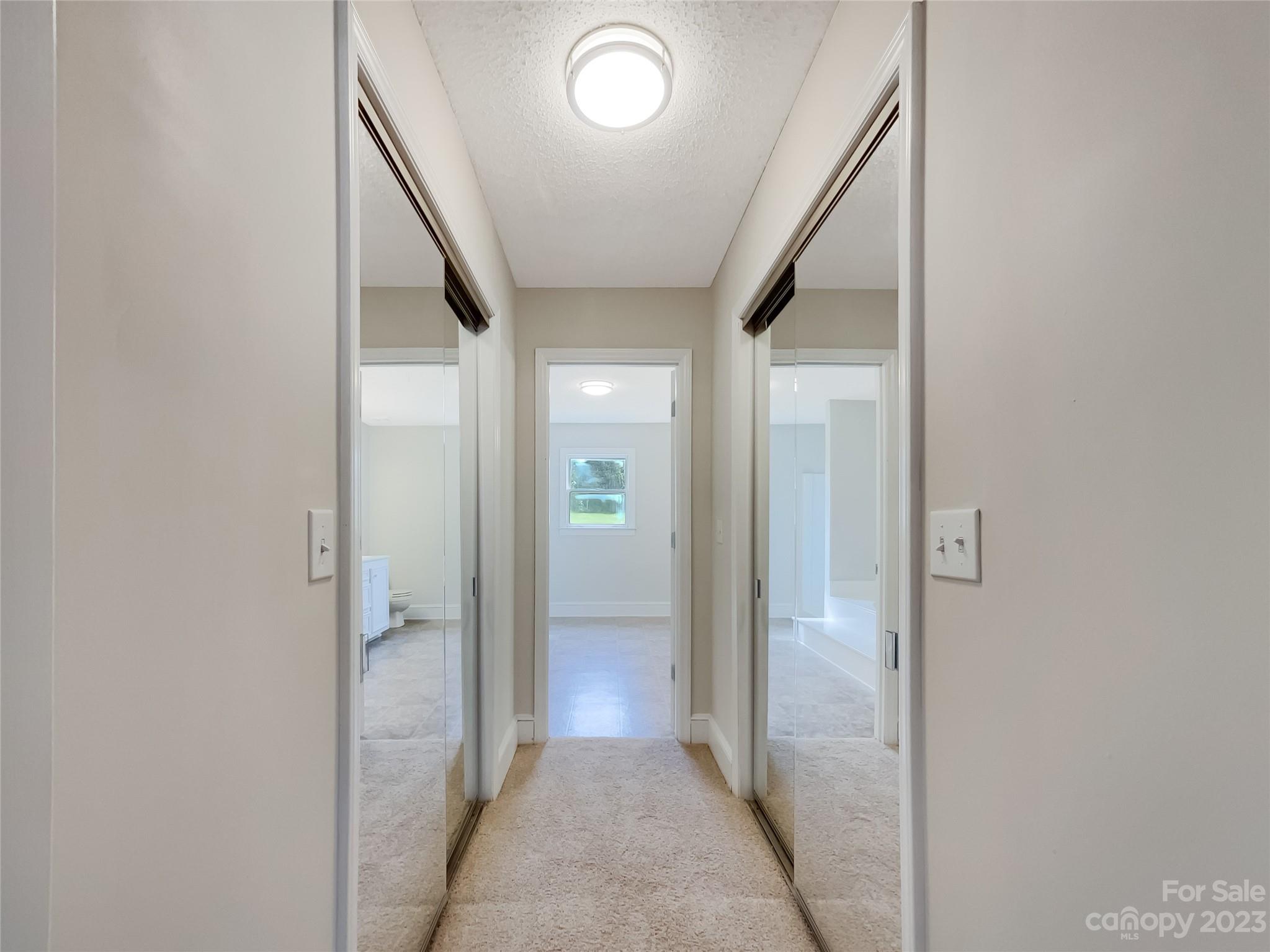 4719 Pleasant Grove Road Waxhaw, NC 28173 - Photo 19 of 24 a view of a hallway with wooden shelves