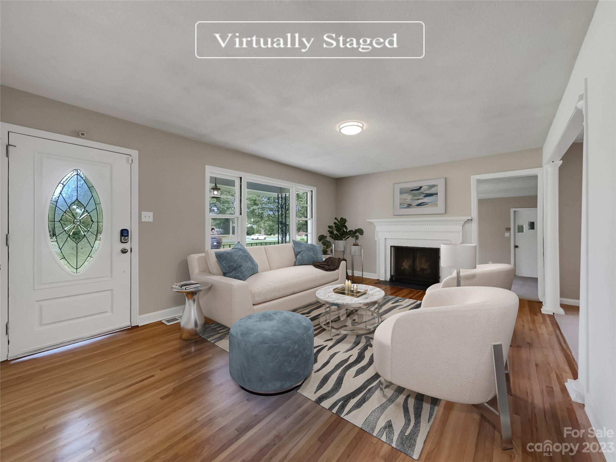 4719 Pleasant Grove Road Waxhaw, NC 28173 - Photo 2 of 24 a living room with furniture and a fireplace