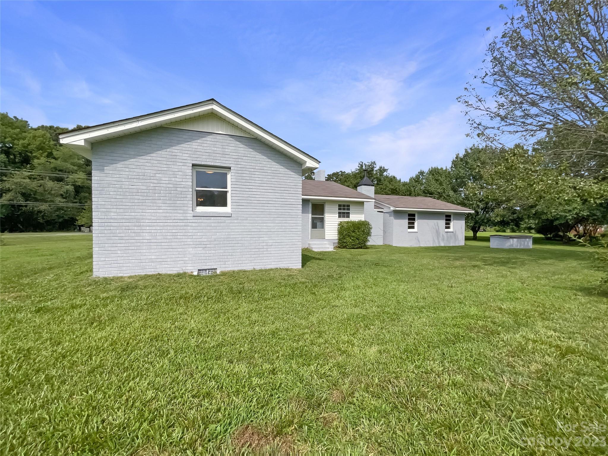 4719 Pleasant Grove Road Waxhaw, NC 28173 - Photo 23 of 24 a house view with a garden space