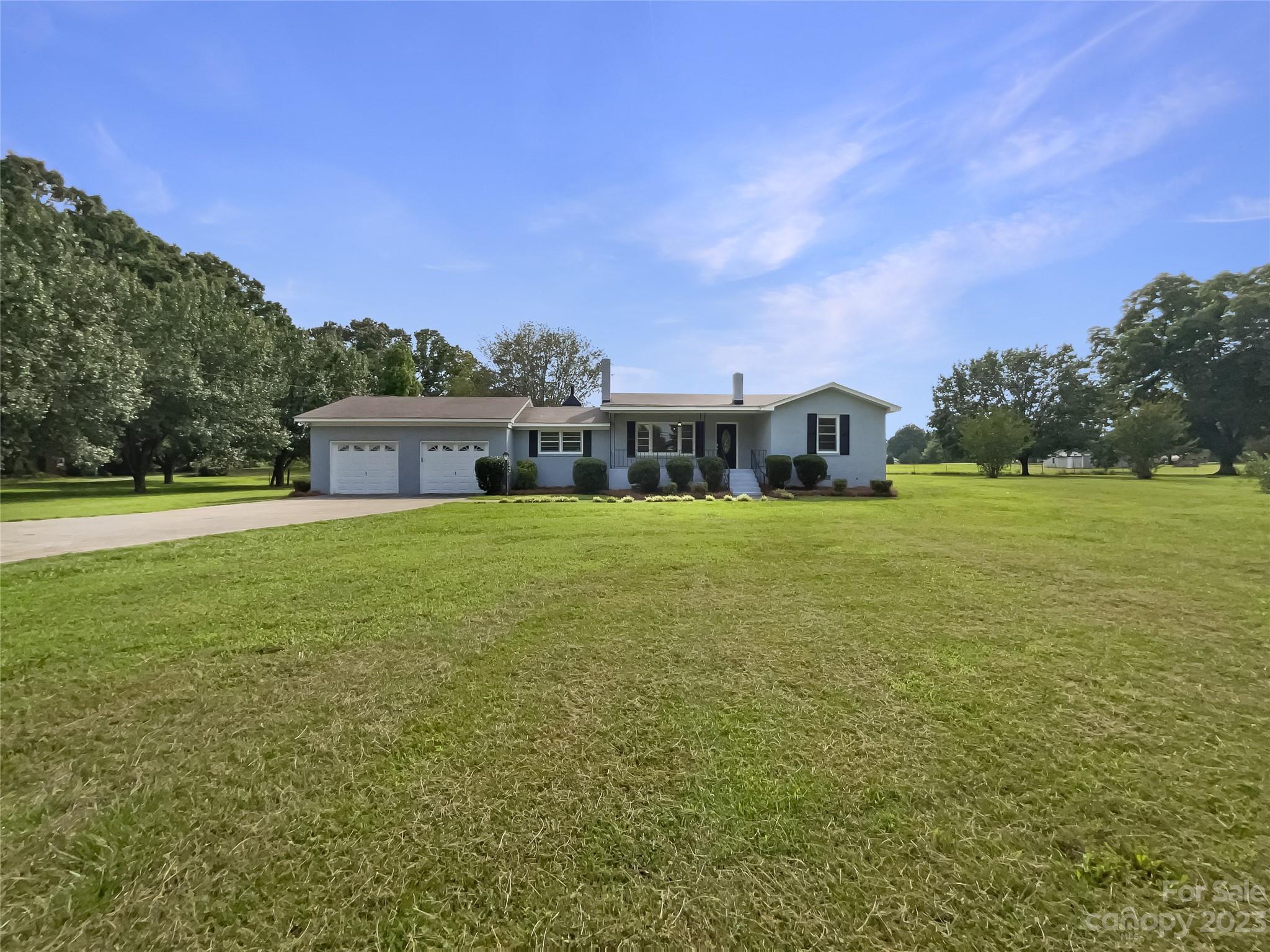 4719 Pleasant Grove Road Waxhaw, NC 28173 - Photo 6 of 24 a view of a house with a big yard