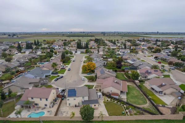 an aerial view of a city with lawn chairs
