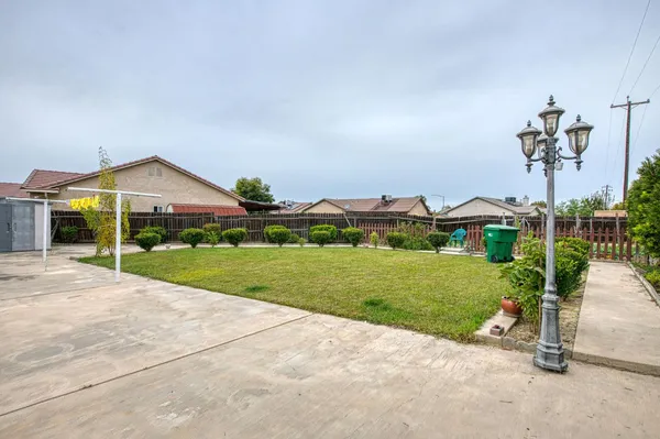 a front view of house with yard and seating area