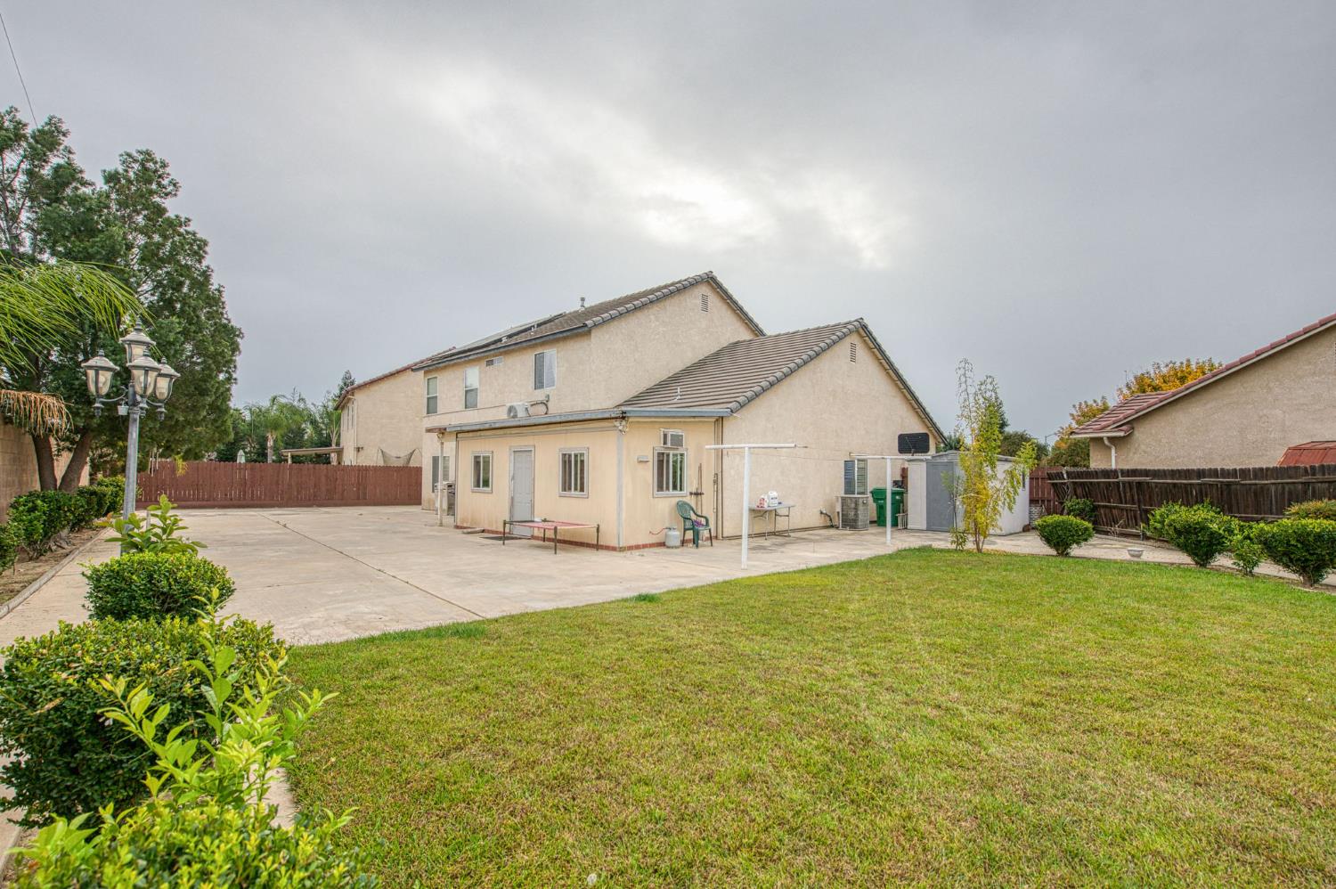 1002 Sequoia Court Fowler, CA 93625 - Photo 21 of 54 a view of a house with a yard and pathway