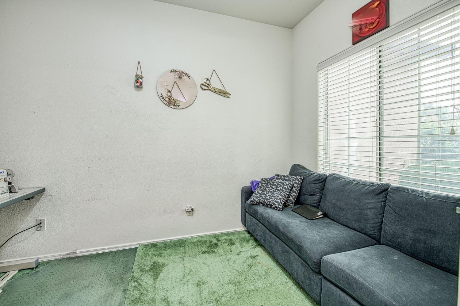 1002 Sequoia Court Fowler, CA 93625 - Photo 25 of 54 a living room with furniture and a window