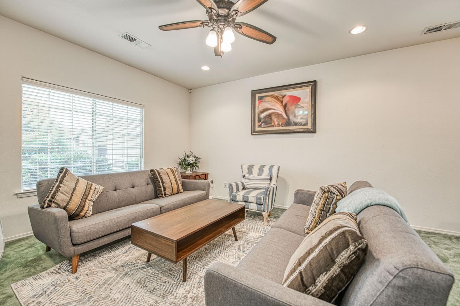 1002 Sequoia Court Fowler, CA 93625 - Photo 26 of 54 a living room with furniture and a large window
