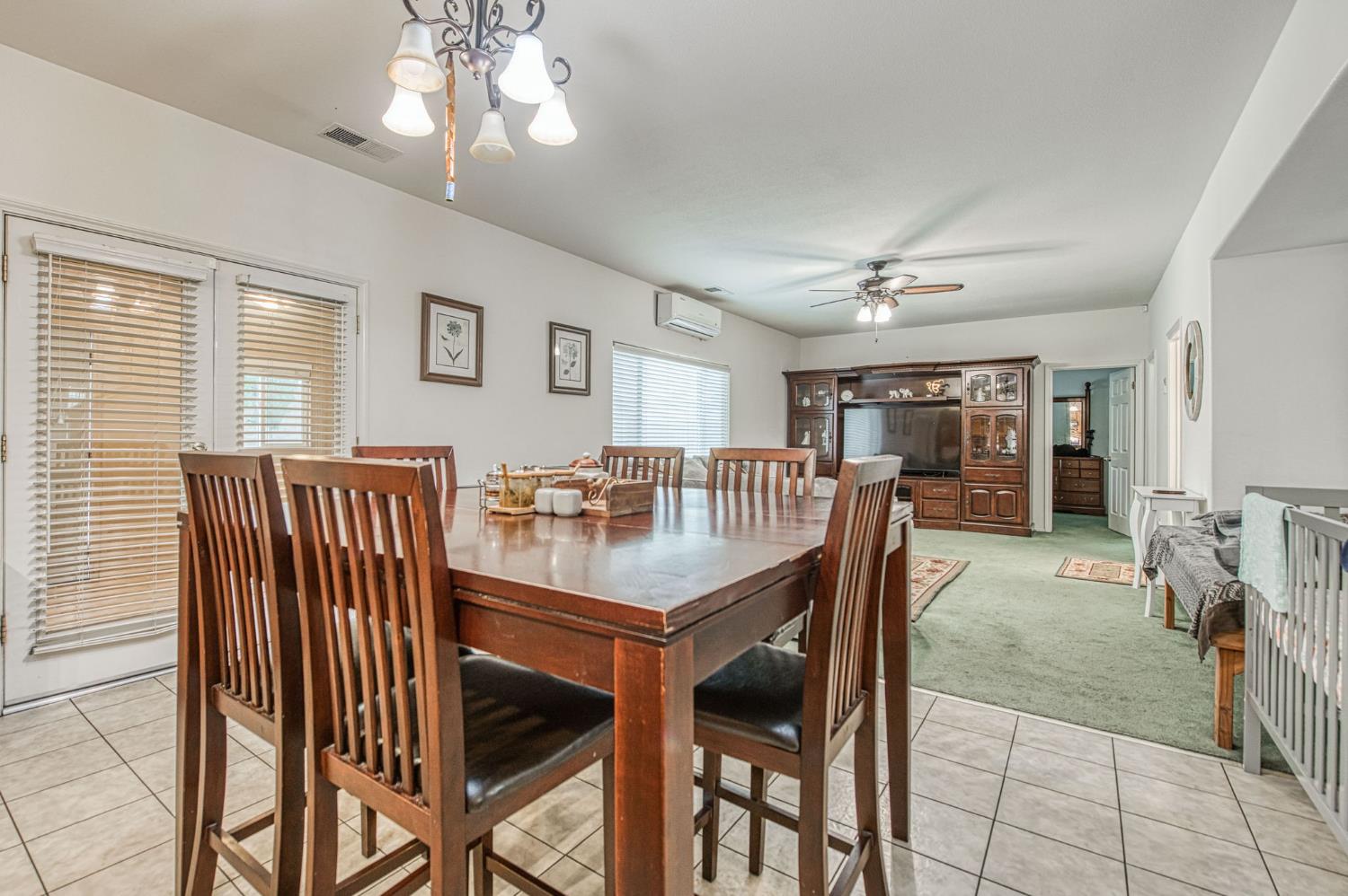 1002 Sequoia Court Fowler, CA 93625 - Photo 34 of 54 a view of a dining room with furniture and chandelier