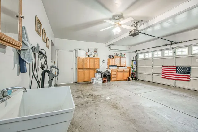 a kitchen with stainless steel appliances a refrigerator and a stove top oven