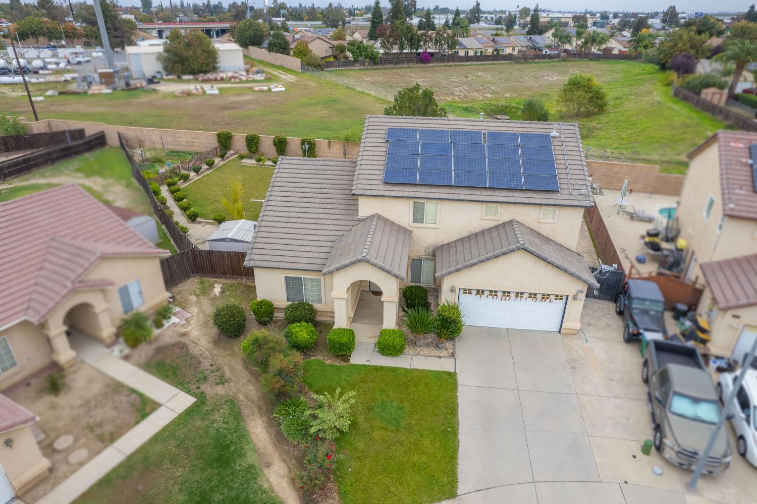 1002 Sequoia Court Fowler, CA 93625 - Photo 4 of 54 an aerial view of a house with a lake view