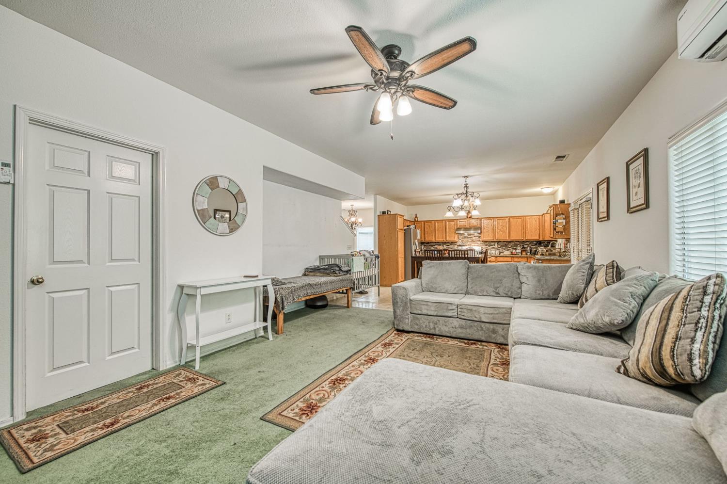 1002 Sequoia Court Fowler, CA 93625 - Photo 41 of 54 a living room with furniture and a clock