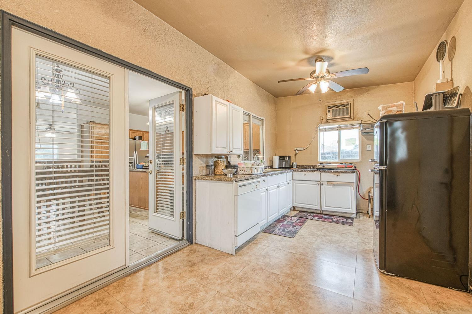 1002 Sequoia Court Fowler, CA 93625 - Photo 44 of 54 a kitchen with stainless steel appliances a refrigerator and a stove top oven