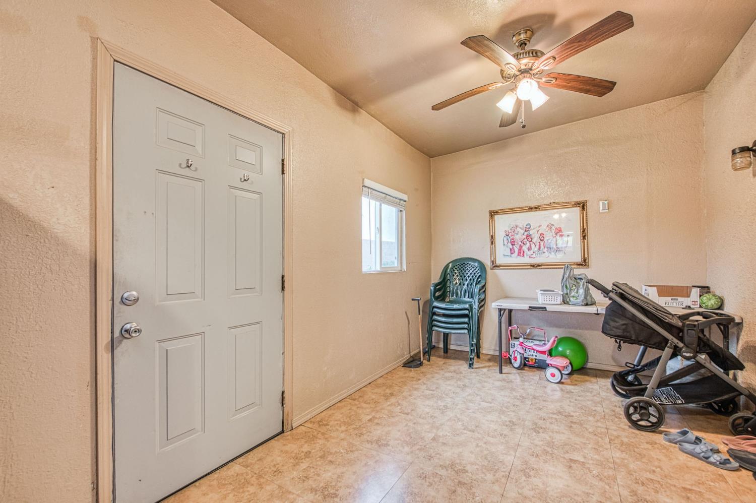 1002 Sequoia Court Fowler, CA 93625 - Photo 45 of 54 a view of a room with gym equipment