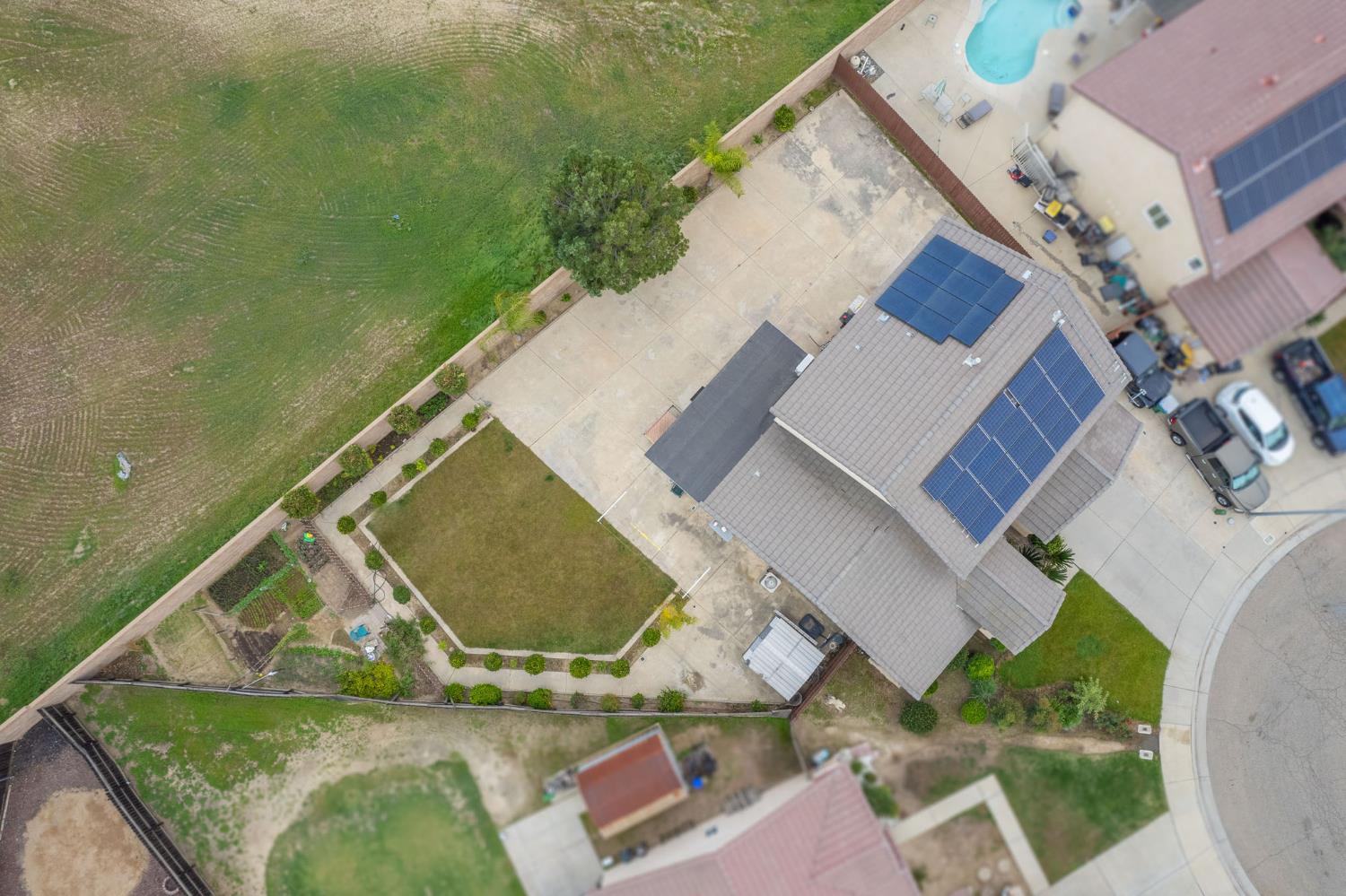 1002 Sequoia Court Fowler, CA 93625 - Photo 6 of 54 an aerial view of a house with swimming pool and outdoor space