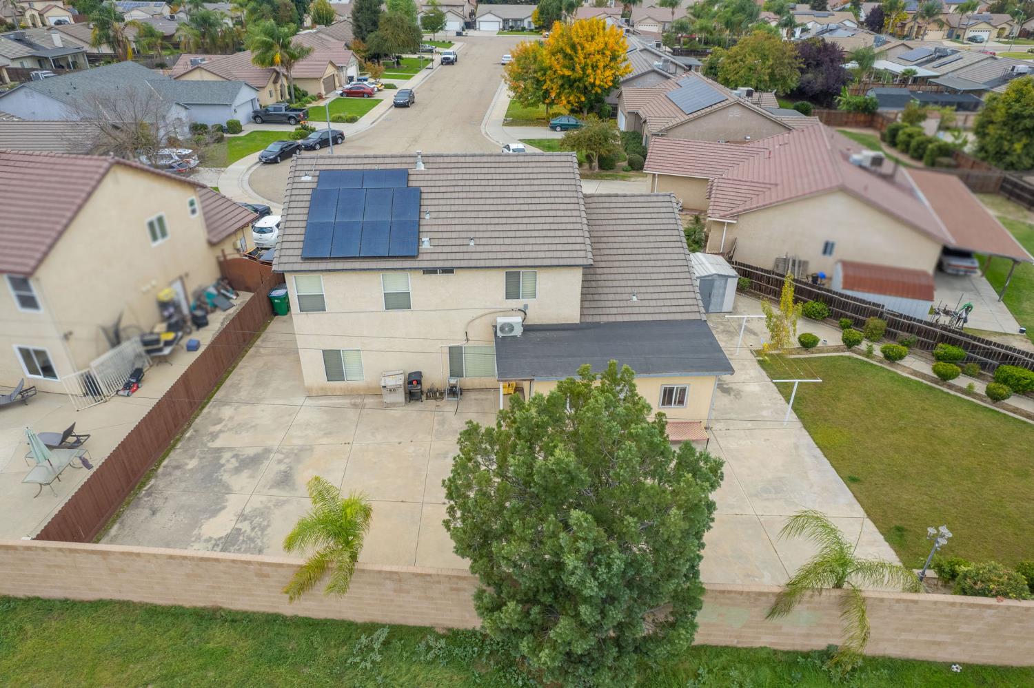 1002 Sequoia Court Fowler, CA 93625 - Photo 9 of 54 an aerial view of a house with swimming pool