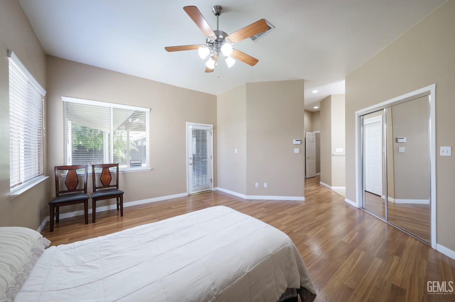 Undisclosed Address Bakersfield, CA 93313 - Photo 12 of 29 a spacious bedroom with a bed and a large window