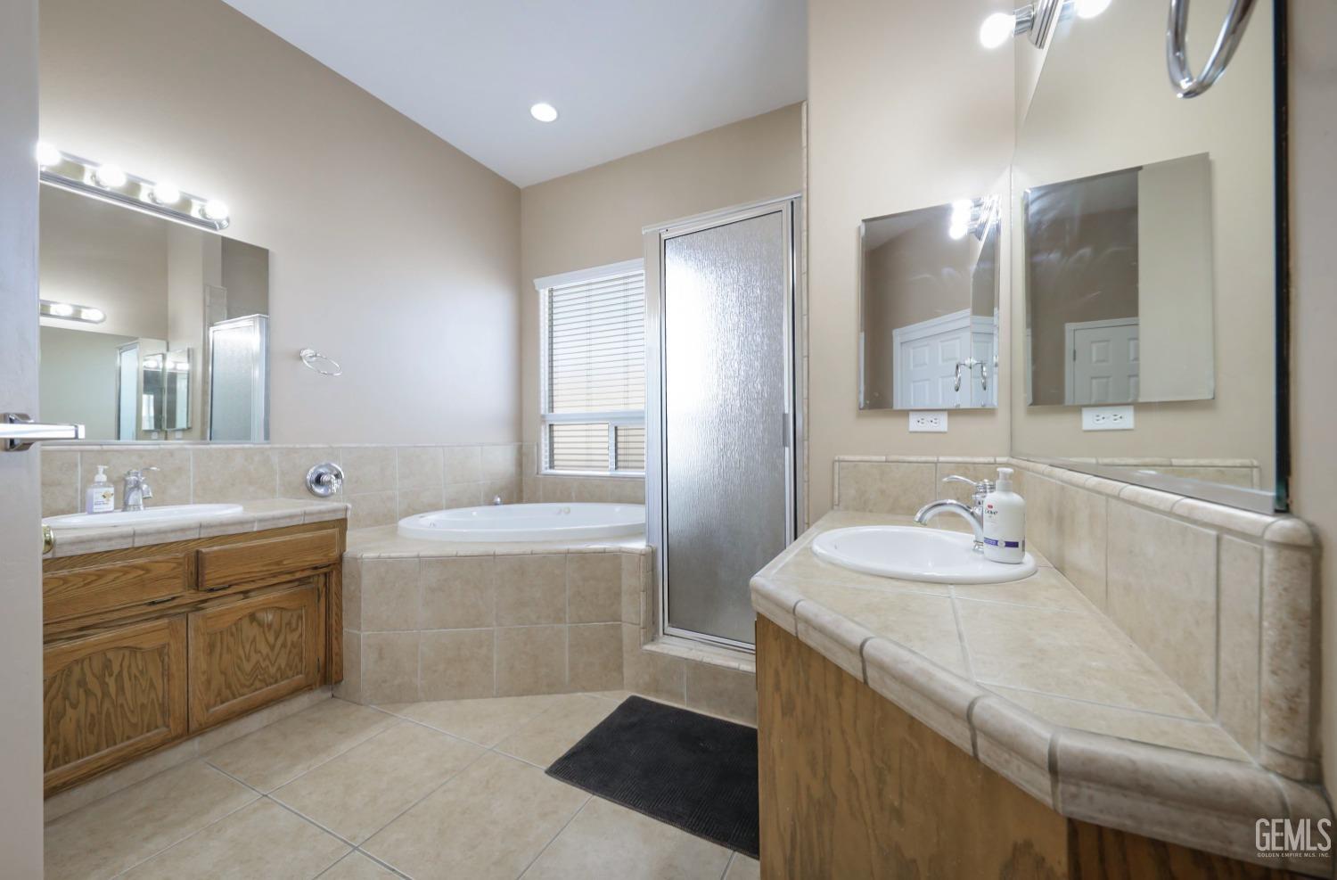 Undisclosed Address Bakersfield, CA 93313 - Photo 13 of 29 a bathroom with a sink double vanity granite and a mirror