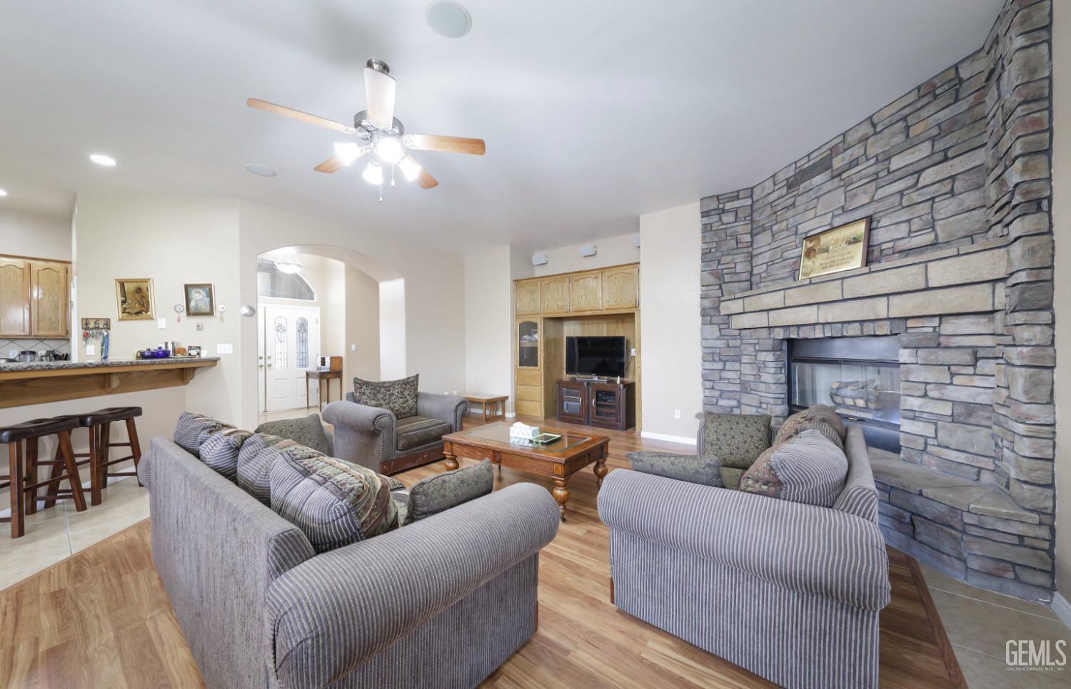 Undisclosed Address Bakersfield, CA 93313 - Photo 17 of 29 a living room with furniture and a fireplace