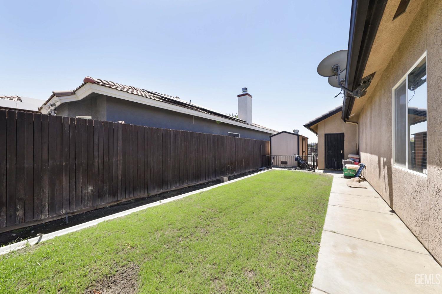 Undisclosed Address Bakersfield, CA 93313 - Photo 26 of 29 a house view with a backyard space