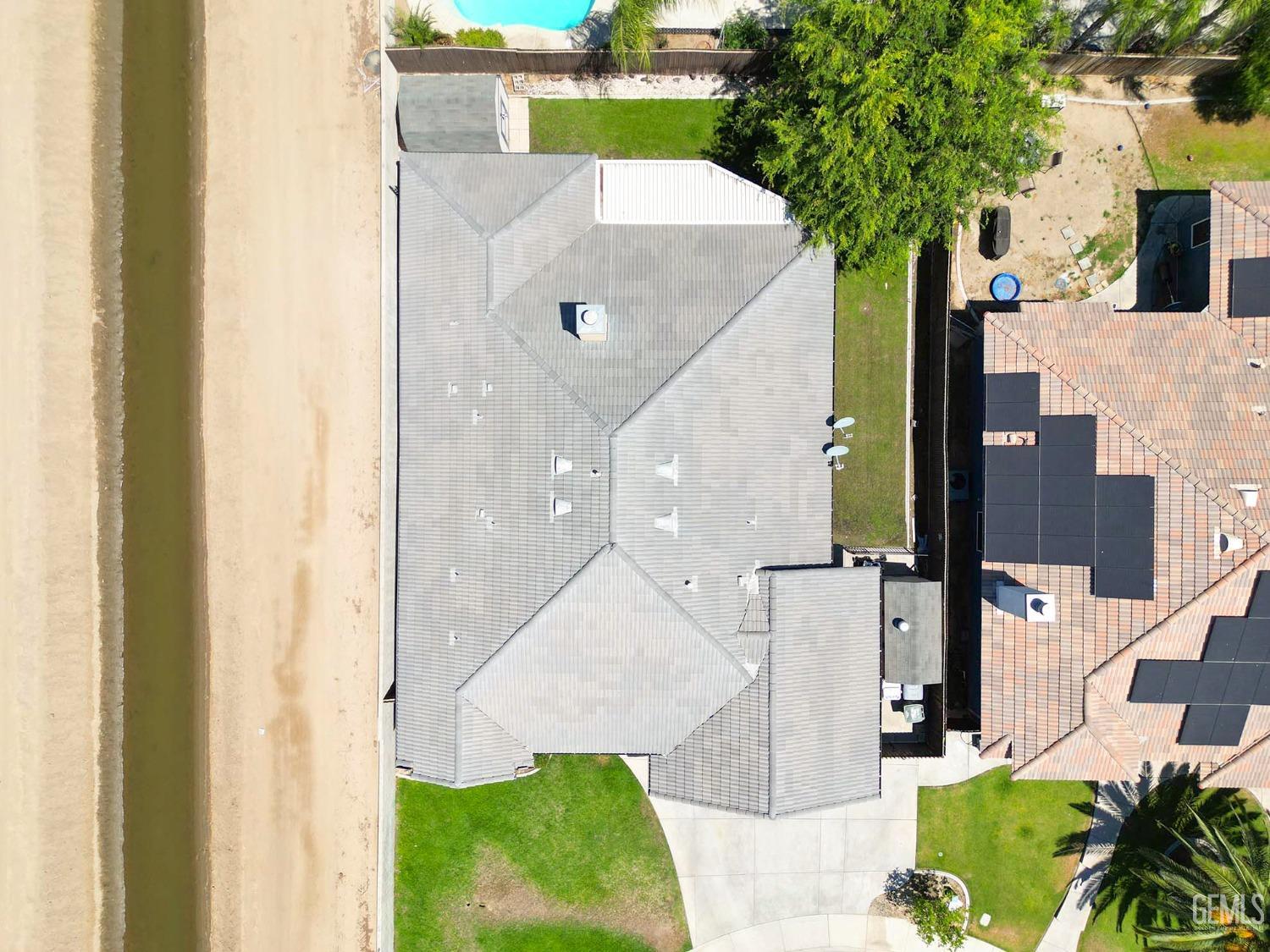 Undisclosed Address Bakersfield, CA 93313 - Photo 27 of 29 an aerial view of a house with a backyard