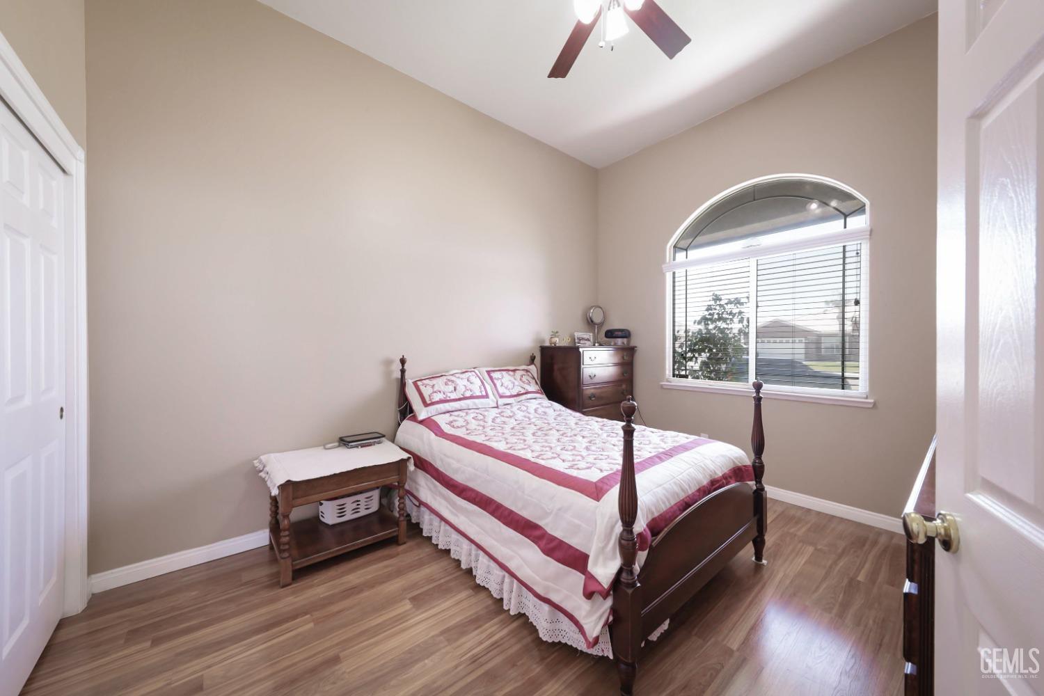 Undisclosed Address Bakersfield, CA 93313 - Photo 6 of 29 a bed sitting in a bedroom next to a window