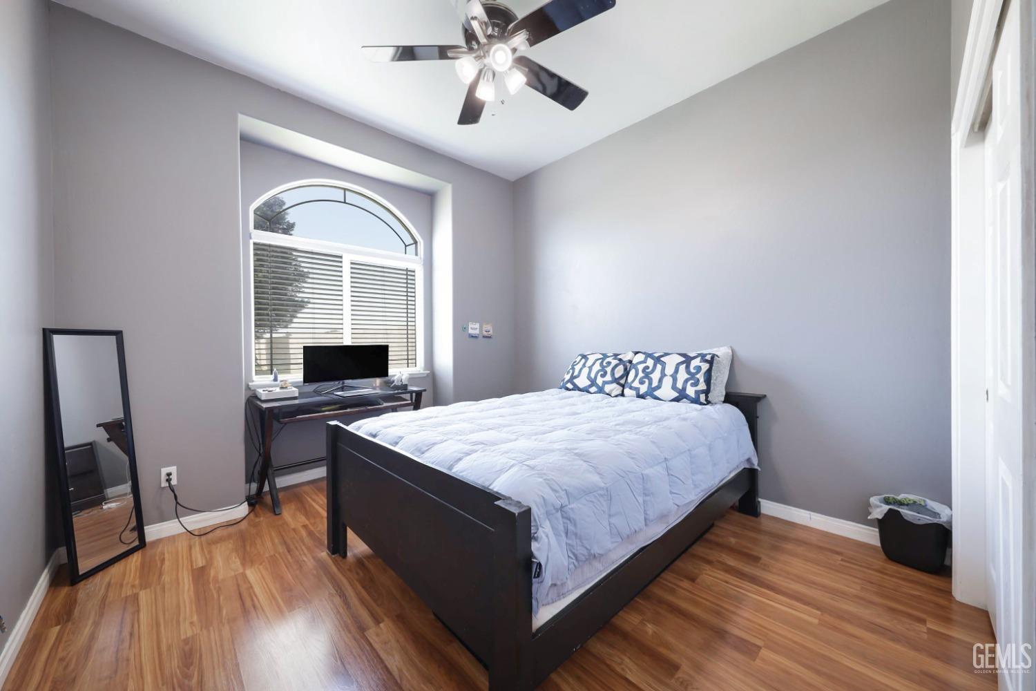 Undisclosed Address Bakersfield, CA 93313 - Photo 8 of 29 a bedroom with a bed and a dresser