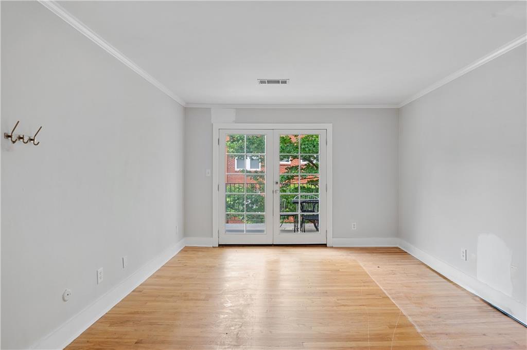 866 Briarcliff Road Northeast, Unit B3 Atlanta, GA 30306 - Photo 9 of 17 wooden floor in an empty room with a window