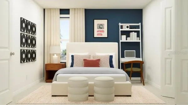 a bedroom with a bed and wall painting