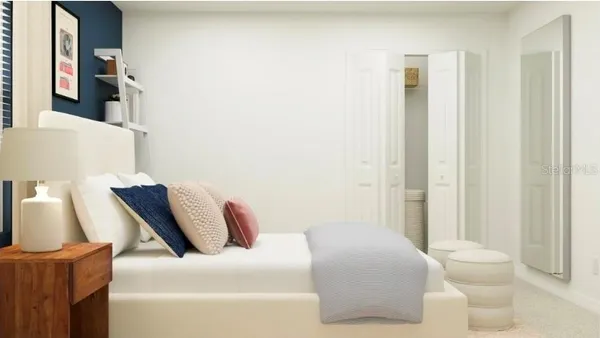 a bedroom with a bed and a couch