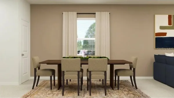 a view of a dining room with furniture