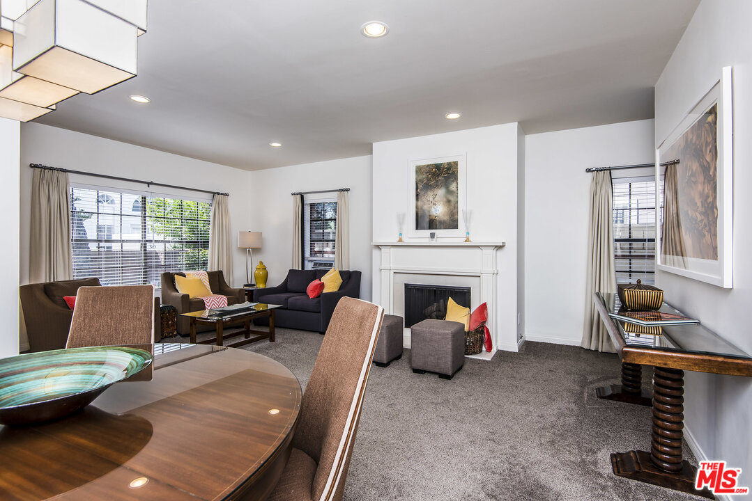 27 30th Avenue Venice, CA 90291 - Photo 13 of 49 a living room with furniture a fireplace and large windows