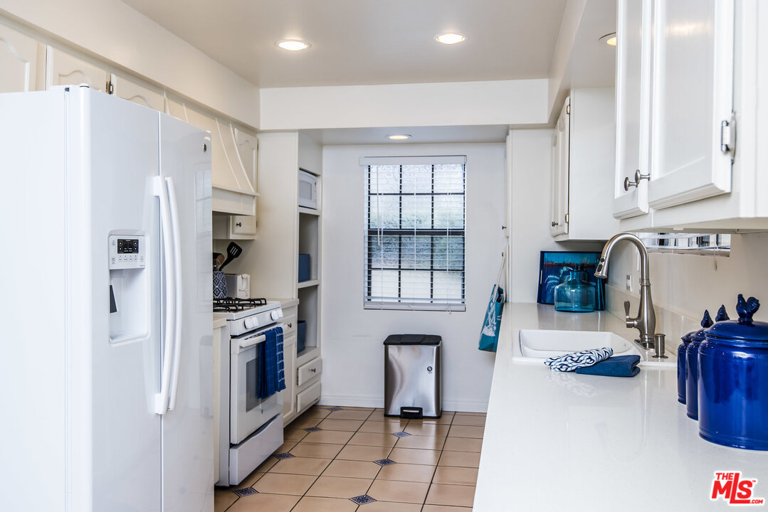 27 30th Avenue Venice, CA 90291 - Photo 17 of 49 a kitchen with stainless steel appliances a refrigerator and a stove top oven