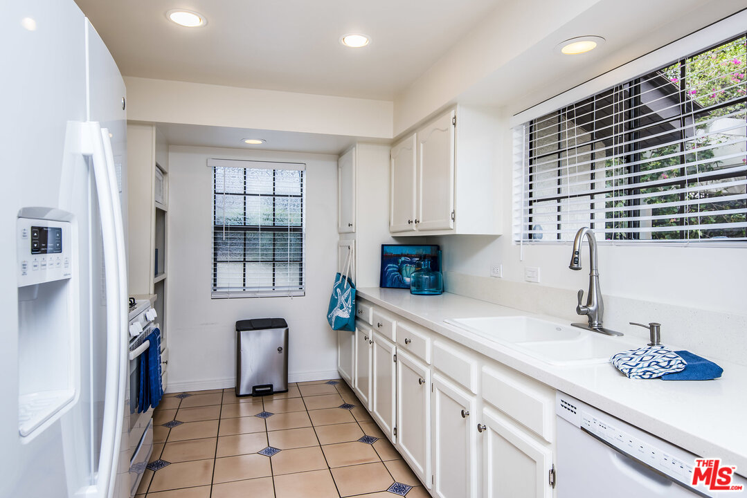 27 30th Avenue Venice, CA 90291 - Photo 18 of 49 a kitchen with stainless steel appliances a sink stove and cabinets