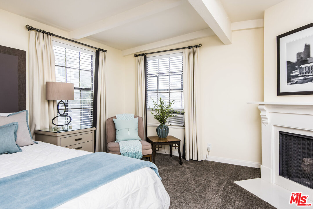 27 30th Avenue Venice, CA 90291 - Photo 22 of 49 a bedroom with a bed and wooden floor