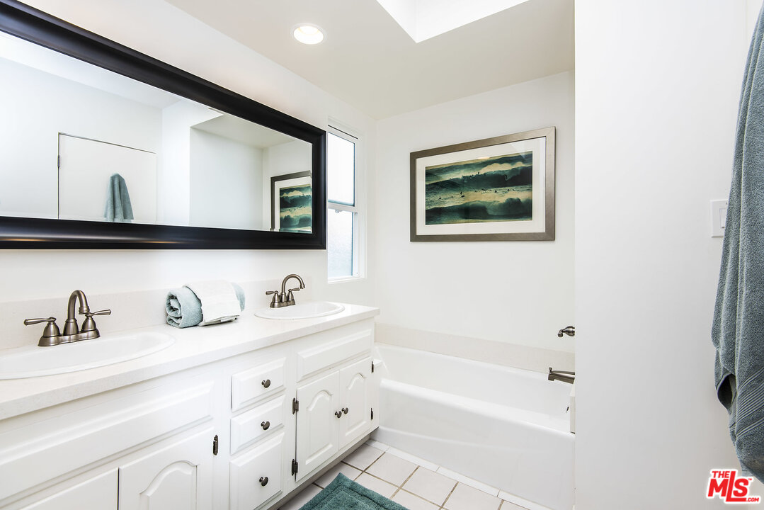 27 30th Avenue Venice, CA 90291 - Photo 26 of 49 a bathroom with mirror and a sink