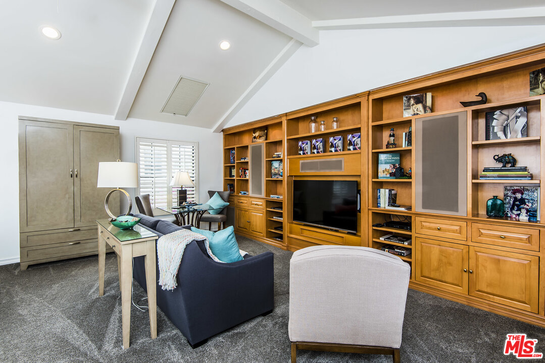 27 30th Avenue Venice, CA 90291 - Photo 34 of 49 a living room with furniture a flat screen tv and kitchen view