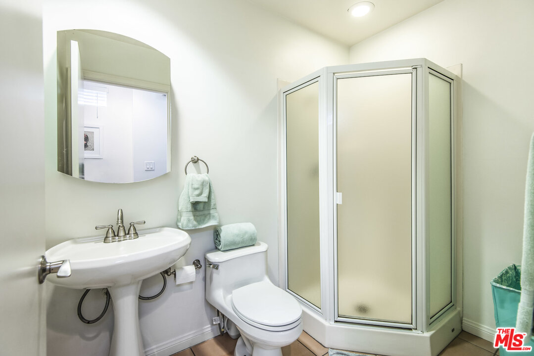 27 30th Avenue Venice, CA 90291 - Photo 39 of 49 a bathroom with a sink a toilet and a mirror