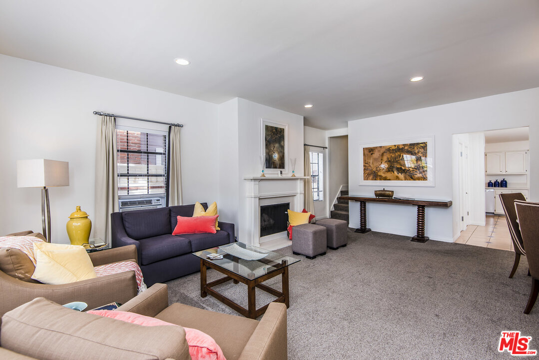 27 30th Avenue Venice, CA 90291 - Photo 8 of 49 a living room with fireplace furniture and a window
