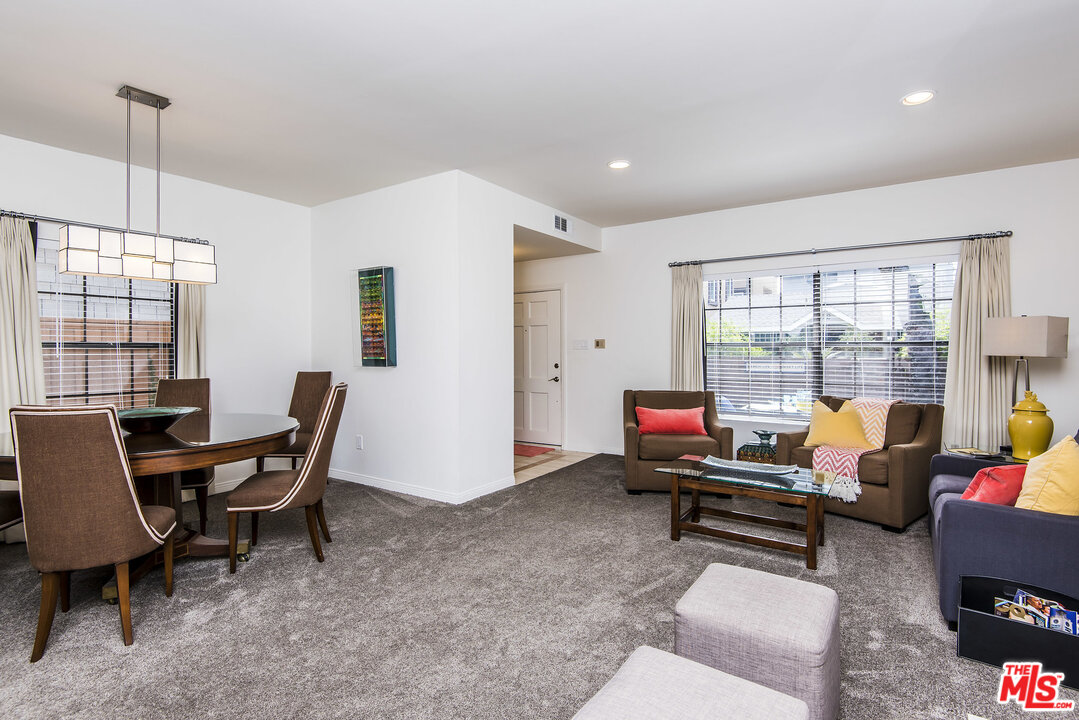27 30th Avenue Venice, CA 90291 - Photo 10 of 49 a living room with furniture and a floor to ceiling window
