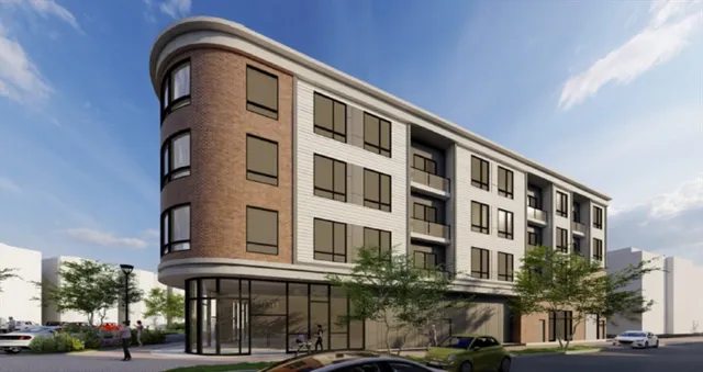 a front view of a building with a street