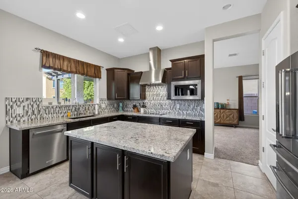 a kitchen with a sink and a stove