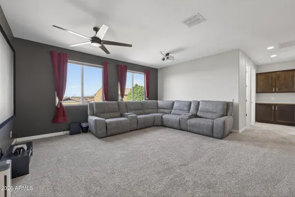 a bedroom with a large bed and a large window