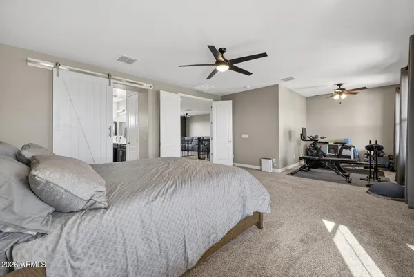 a room with gym equipment and a large window