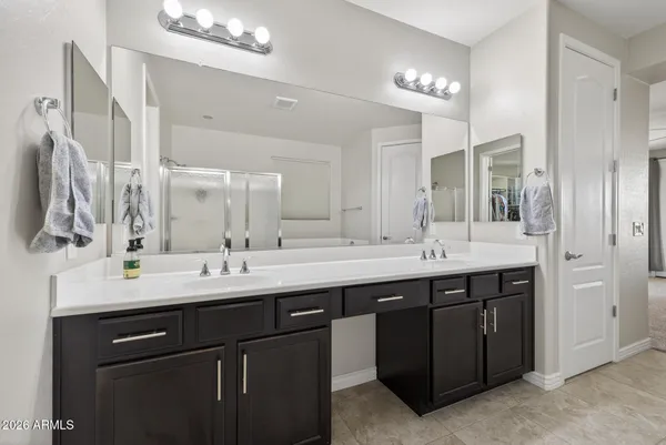 a spacious bedroom with a bed and a window