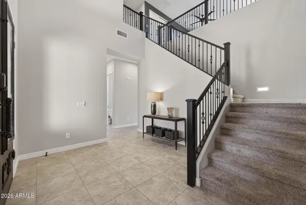 a balcony view with a seating space