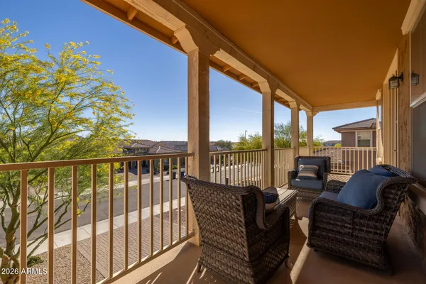 a view of a dining room with a table and chairs