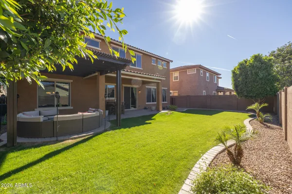 a view of an house with backyard porch and sitting area