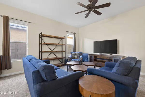a living room with furniture and a rug