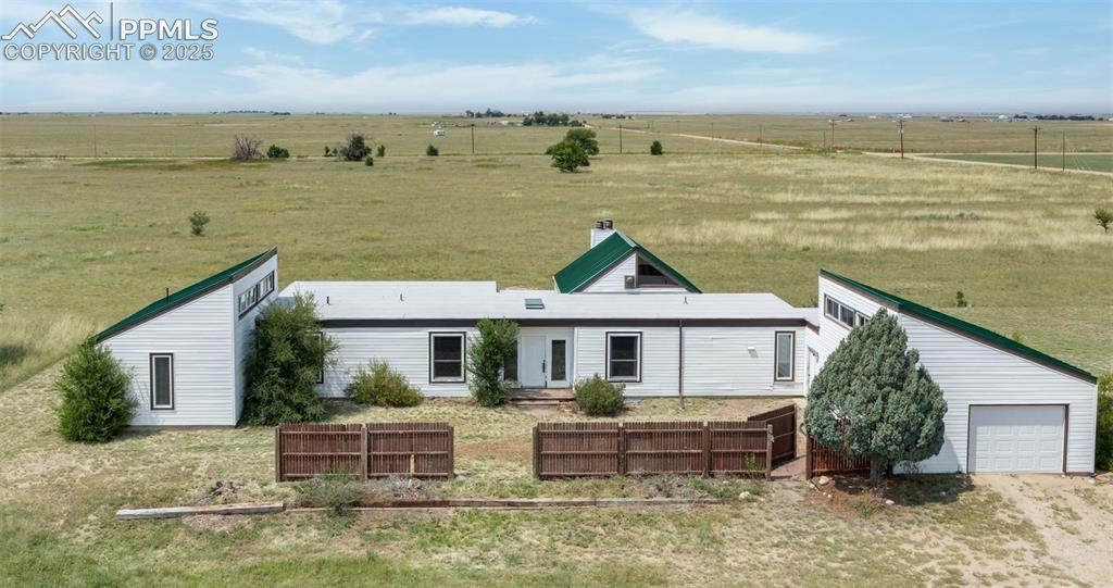 a front view of a house with a ocean view