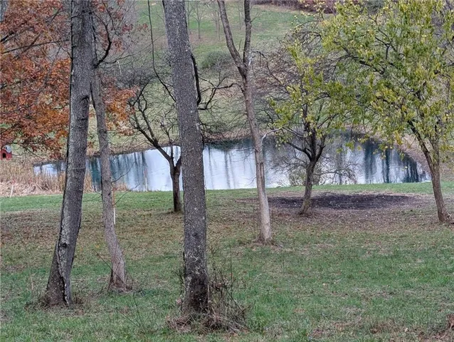 a view of a lake with green space